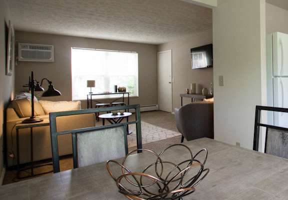 This is a photo of the dining room in the 740 square foot 1 bedroom model apartment at Compton Lake Apartments in Mt. Healthy, OH.