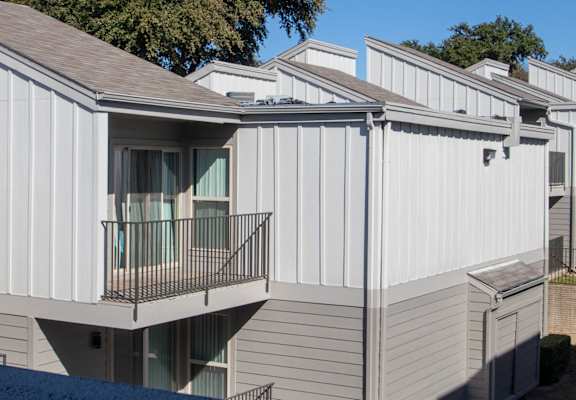 a row of white rental apartments with balconies  at The Biltmore, Dallas, Texas