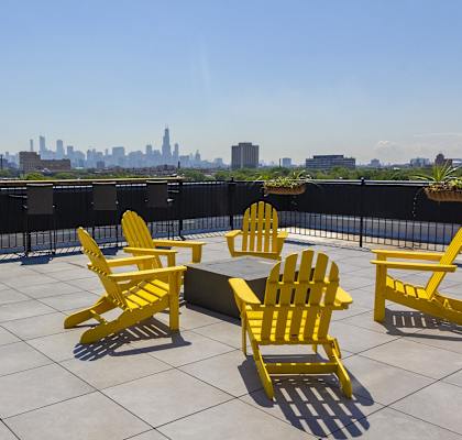 Luxury pet-friendly patio at Highpoint Wicker Park apartments in Chicago with grill, seating, and city views