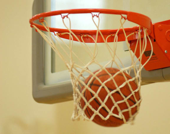a basketball hoop with a red ball in it