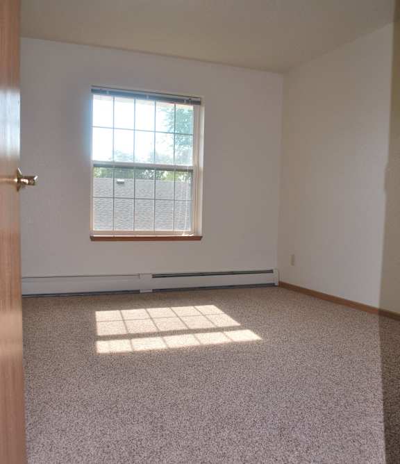 a living room with a couch and a chair and a table
