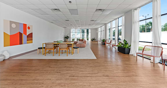 A room with a large painting on the wall and wooden flooring. at The Teale Siesta Lago in Kissimmee, FL, 34746