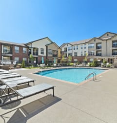 Austin Park Apartments Miamisburg Ohio Pet Friendly Amenity Resort Style Swimming Pool and Sundeck with Shaded tables and lounge chairs