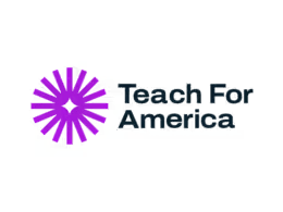 A purple flower-like object is in front of a black background with some text.