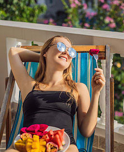 Woman on patio on eating fruit  at Bonita Pointe, Florida