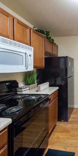 a kitchen with a stove microwave and refrigerator