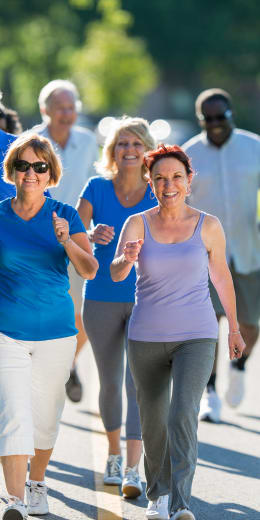 a group of women walking down a street