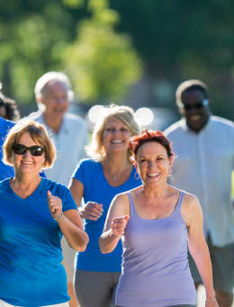 a group of women walking down a street