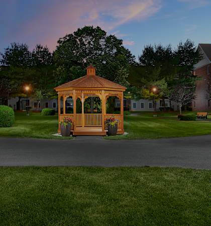 Hampshire Green Apartments gazebo at dusk with walking paths