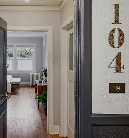 Apartment entryway with hardwood flooring