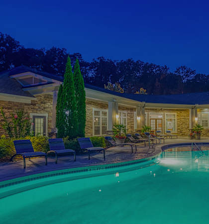 The Oaks at Johns Creek - Resort-style pool at dusk