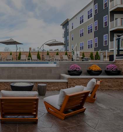 The Airdrie at Paoli Station - Poolside fire pit with seating