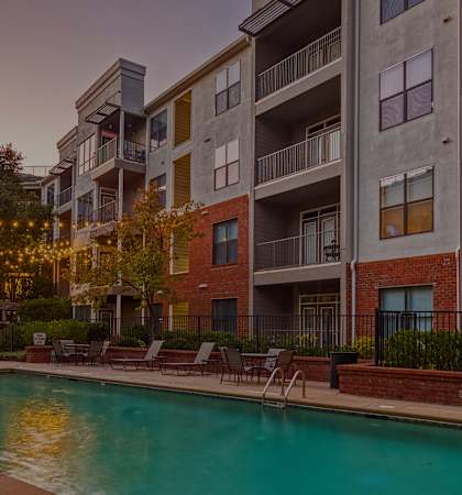 Perimeter Gardens - Separate lap pool at dusk with lighting