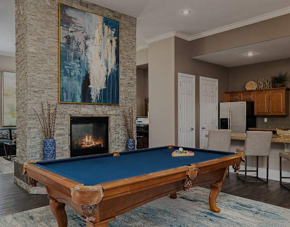 Cordillera Ranch Apartments billiards table and indoor fireplace
