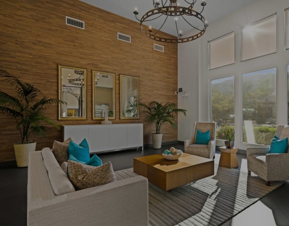 Foothills at Old Town Apartments clubhouse interior with large windows and seating