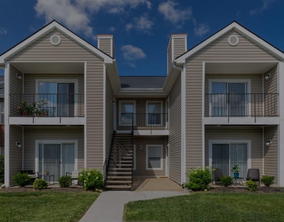 Building exterior with large patio or balcony - East Chase Apartments