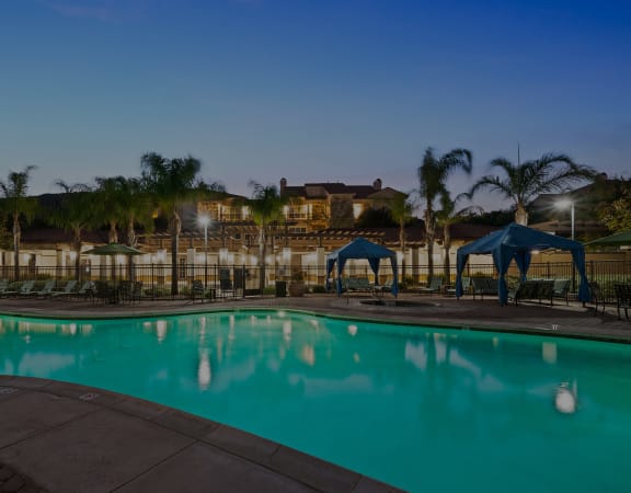 Foothills at Old Town Apartments pool with poolside cabanas and surrounding sundeck