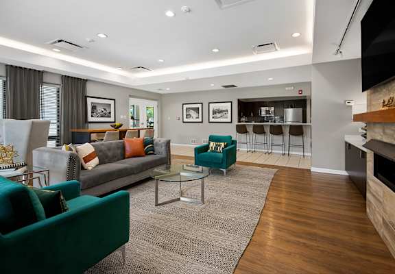 A living room with a green couch and a coffee table.