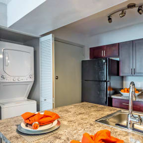 full kitchen with stainless steel appliances and granite counter tops and a sink at Skyview Apartments, Colorado, 80234