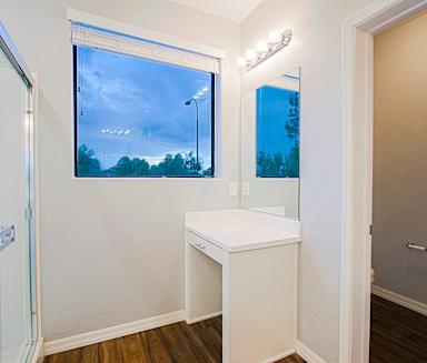 a bathroom with a large window and a sink