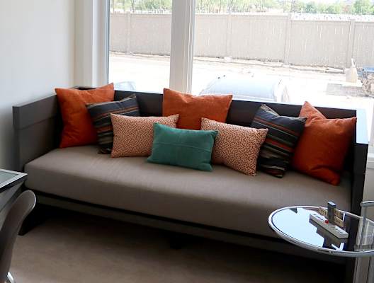 Beige Couch With Colourful Pillows
