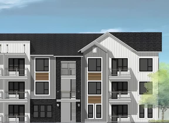 A modern apartment building with balconies and a mix of window designs.