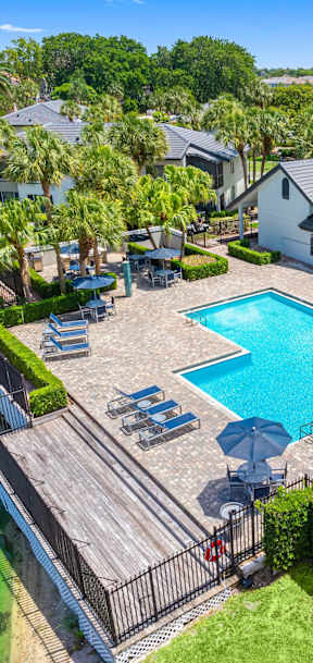 A large house with a pool in the backyard.