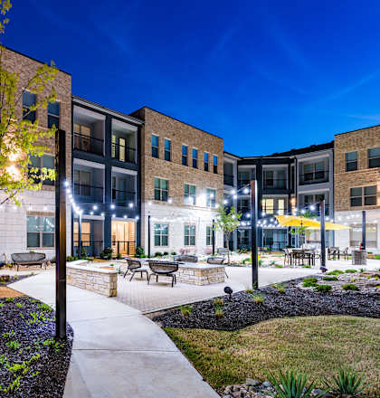 our apartments showcase a beautiful courtyard at night