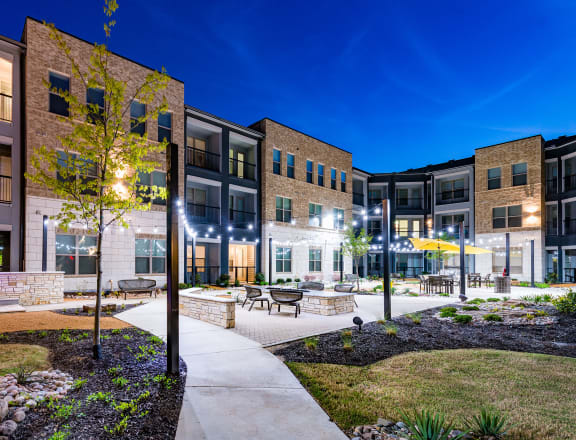 our apartments showcase a beautiful courtyard at night