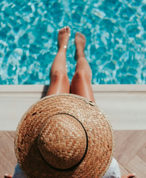 Lady near pool  at Imperial Crossing Luxury Apartment Homes, Bonita Springs, FL, 34134