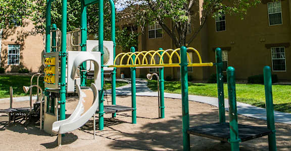 a playground with a slide in a park