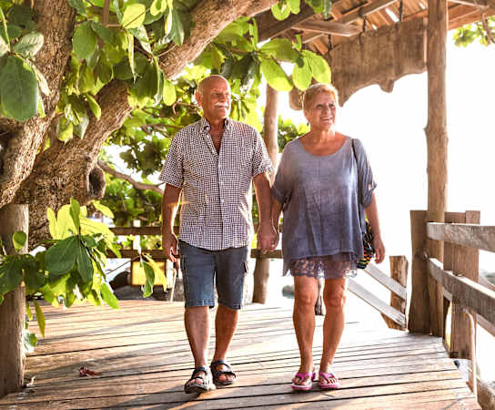 a man and a woman walking on a wooden bridgeat Bella Vista on Park, Florida, 33563