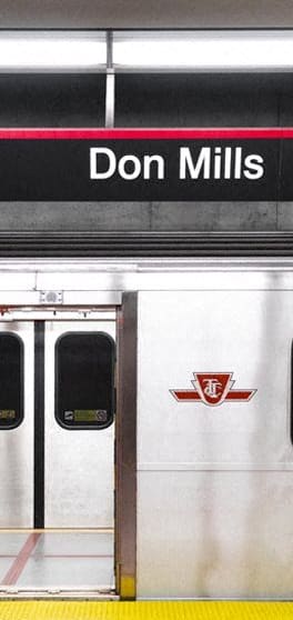 a subway train with a door and a sign that says