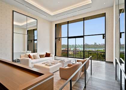 A modern living room with a view of the city.