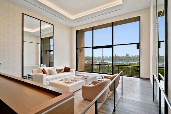 A modern living room with a view of the city.