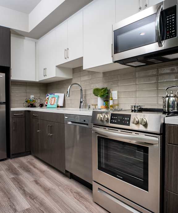 model kitchen with stainless steel appliances