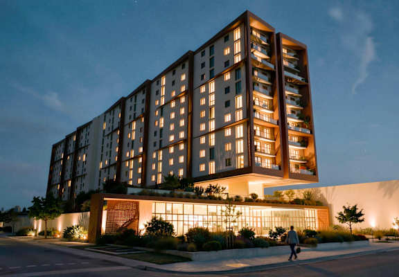 A tall building with a person walking in front of it.