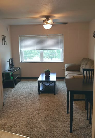 a living room with a couch and a table
