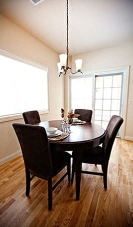 a dining room with a table and chairs at The Residences at Toscana Park, Granger, Indiana