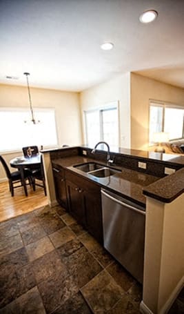 a kitchen with a sink and a counter top at The Residences at Toscana Park, Granger, Indiana