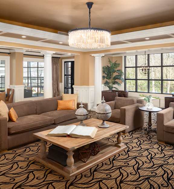 a game room with a pool table and couches