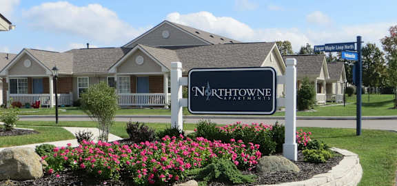 A sign that says Northowne in front of some houses.