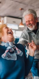 a group of people laughing in a room