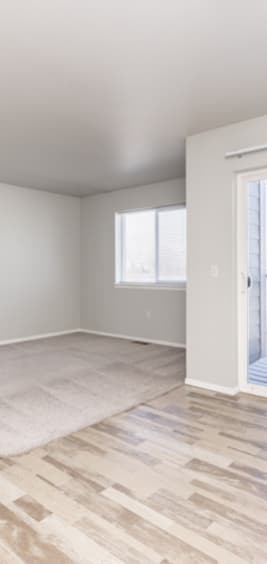 A room with a window and a door.