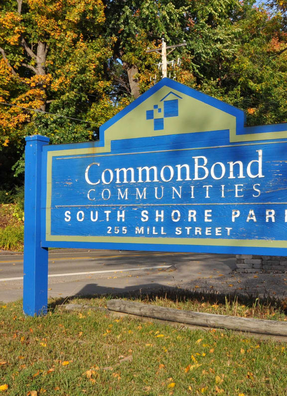 a blue sign that reads common bond communities south shore park