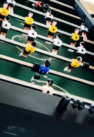 a foosball table in a game room