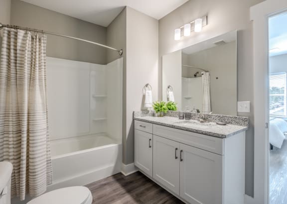 a bathroom with a toilet sink and bathtub