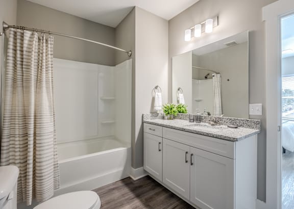 a bathroom with a toilet sink and bathtub