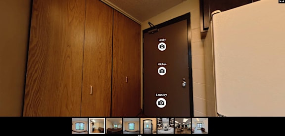 A brown door with a sign that says "Laundry" on it.