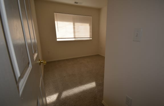 Image of bedroom with carpet and window